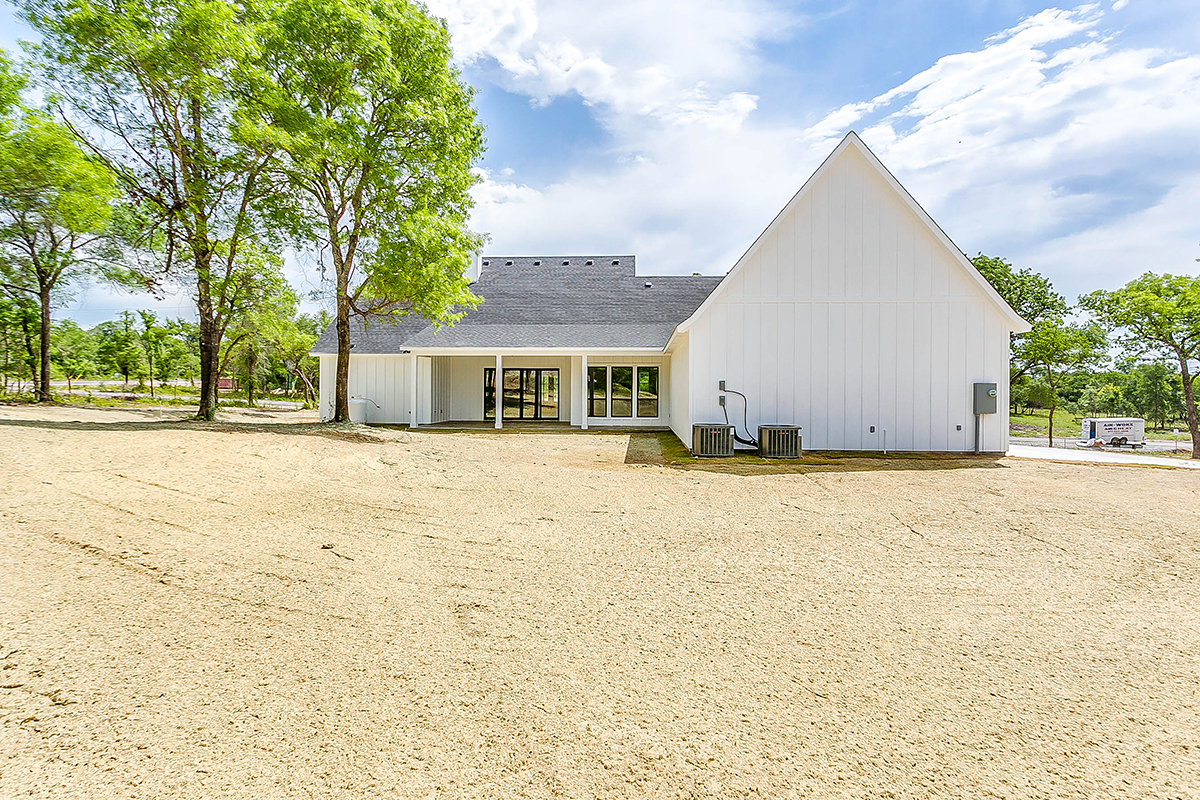 Country, Farmhouse Plan with 2546 Sq. Ft., 4 Bedrooms, 3 Bathrooms, 3 Car Garage Rear Elevation